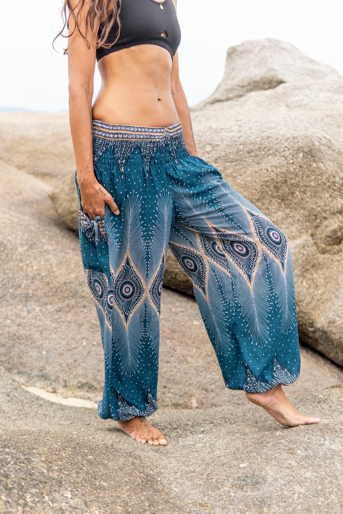 Airy harem pants with a peacock pattern in turquoise – Sanuka