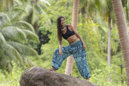 Airy harem pants with an elephant pattern in turquoise with pockets