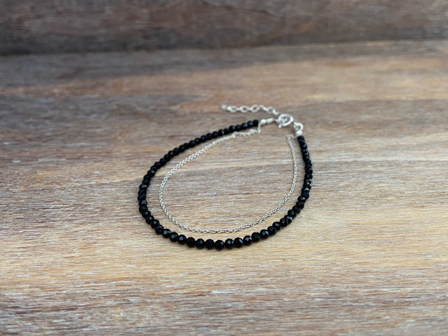 Bracelet with black spinel stones and silver chain 