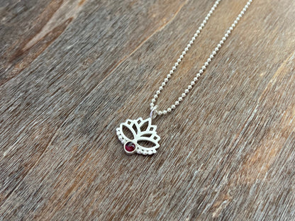 Lotus flower pendant with garnet stone and silver dots 