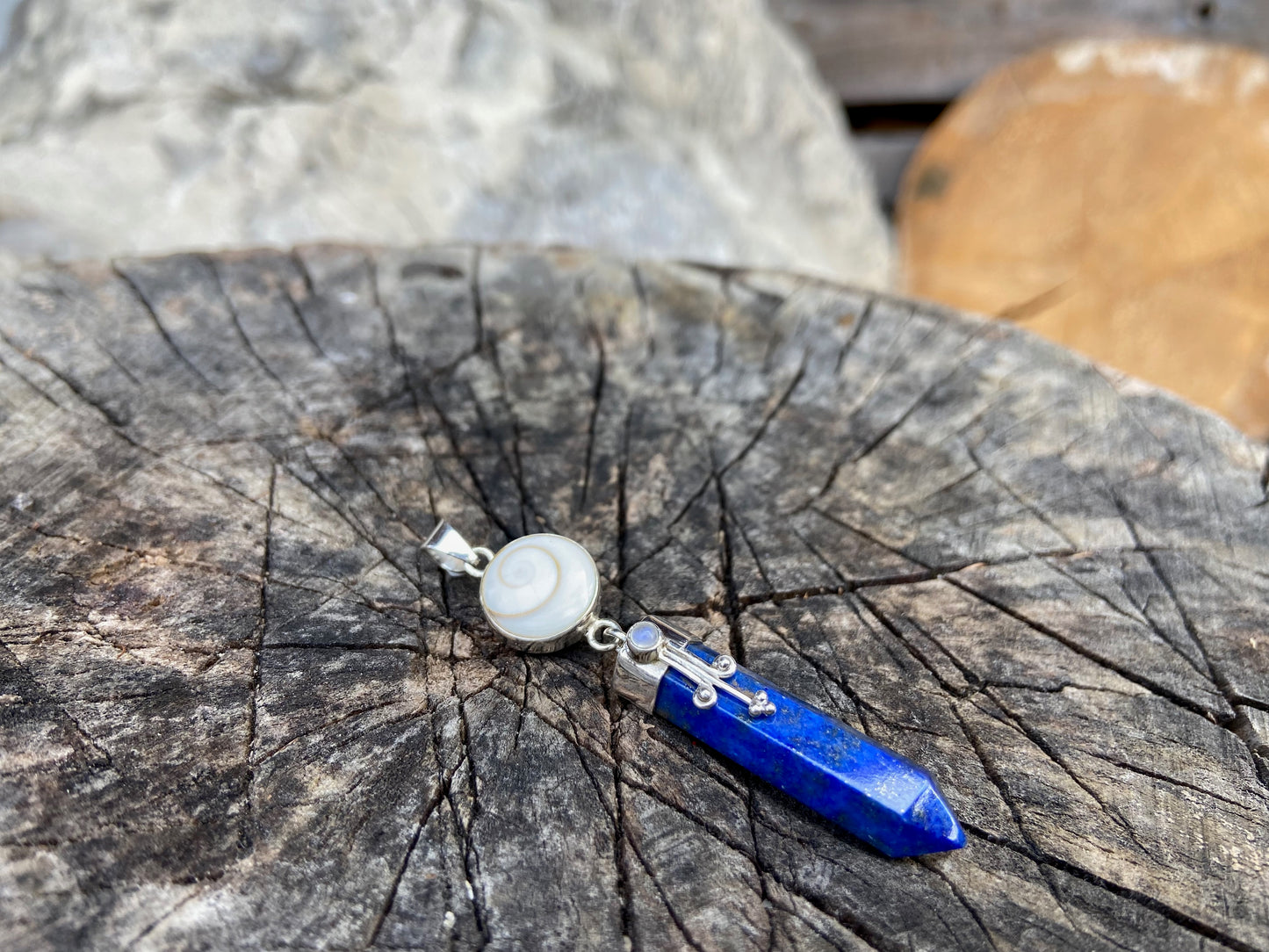 Lapis Lazuli pendant with operculum with spirals, dots and small stone, silver 