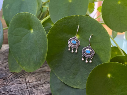 simple silver earrings with faceted oval labradorite stone and dangling beads 