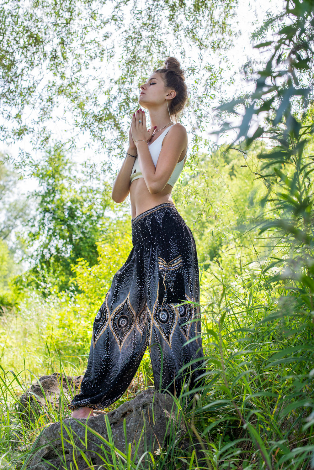 Airy harem pants with a peacock pattern in black