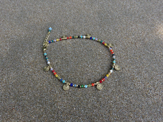 colorful anklet with small spirals made of brass 
