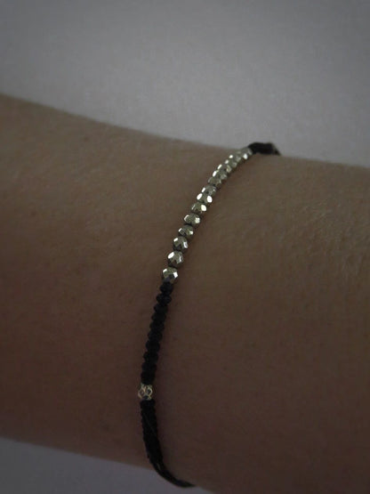 black bracelet with small pyrite stones