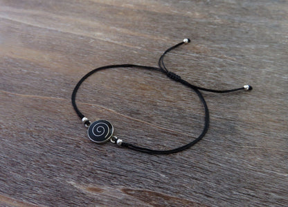 black bracelet with spiral and silver beads 