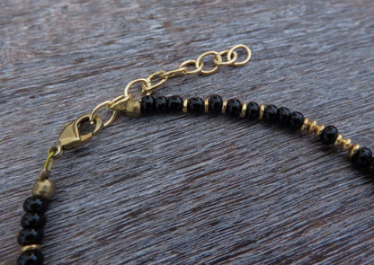 Bracelet with a small brass flower pendant