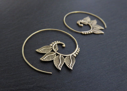 playful spiral earrings with brass leaves 