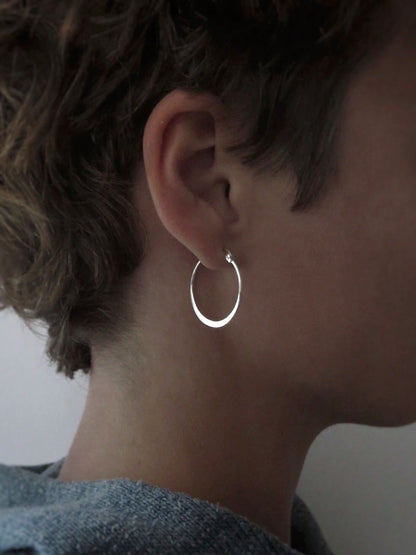 large simple hoop earrings made of silver 