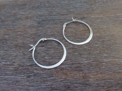 large simple hoop earrings made of silver 
