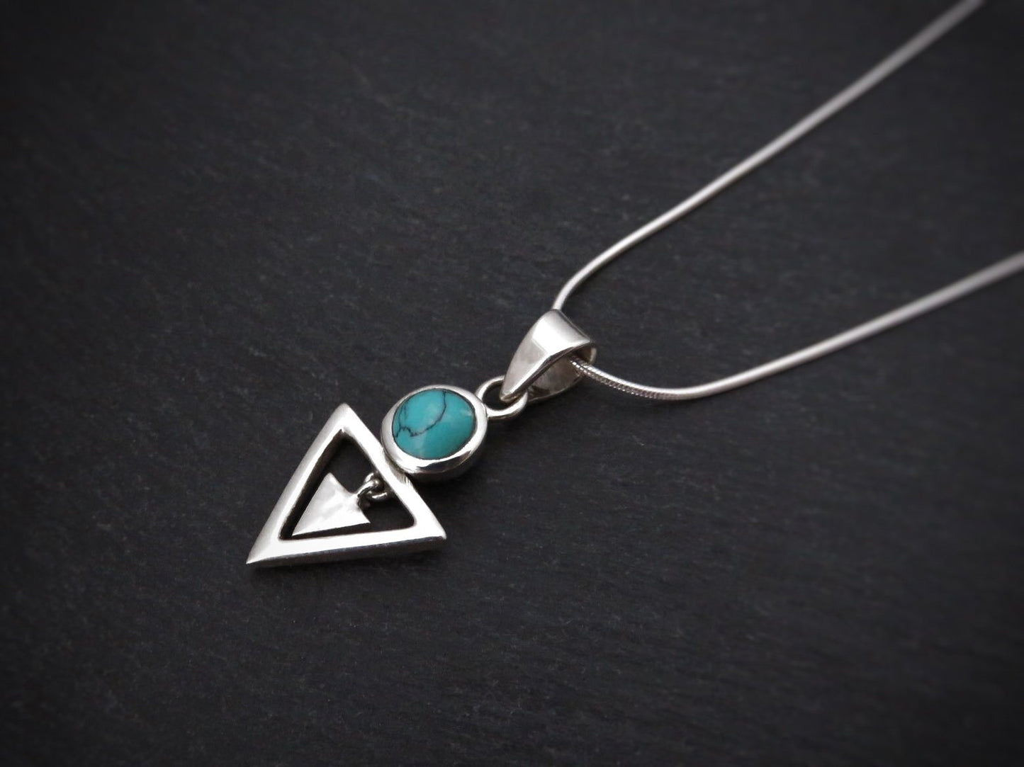 Pendant with stone and small dangling triangle 