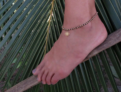 knotted anklet with flower pendant made of brass 