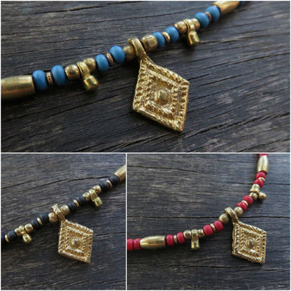 Anklet made of colored beads and brass elements 