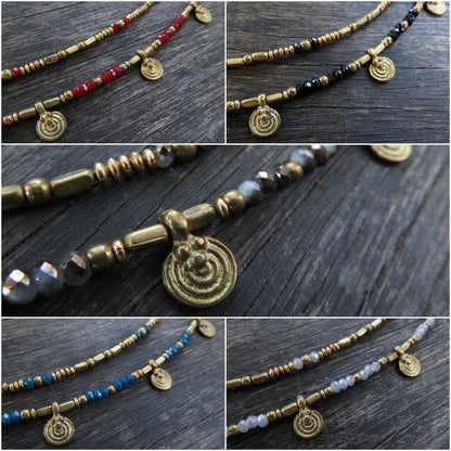 Anklet with spirals made of colored beads and brass 