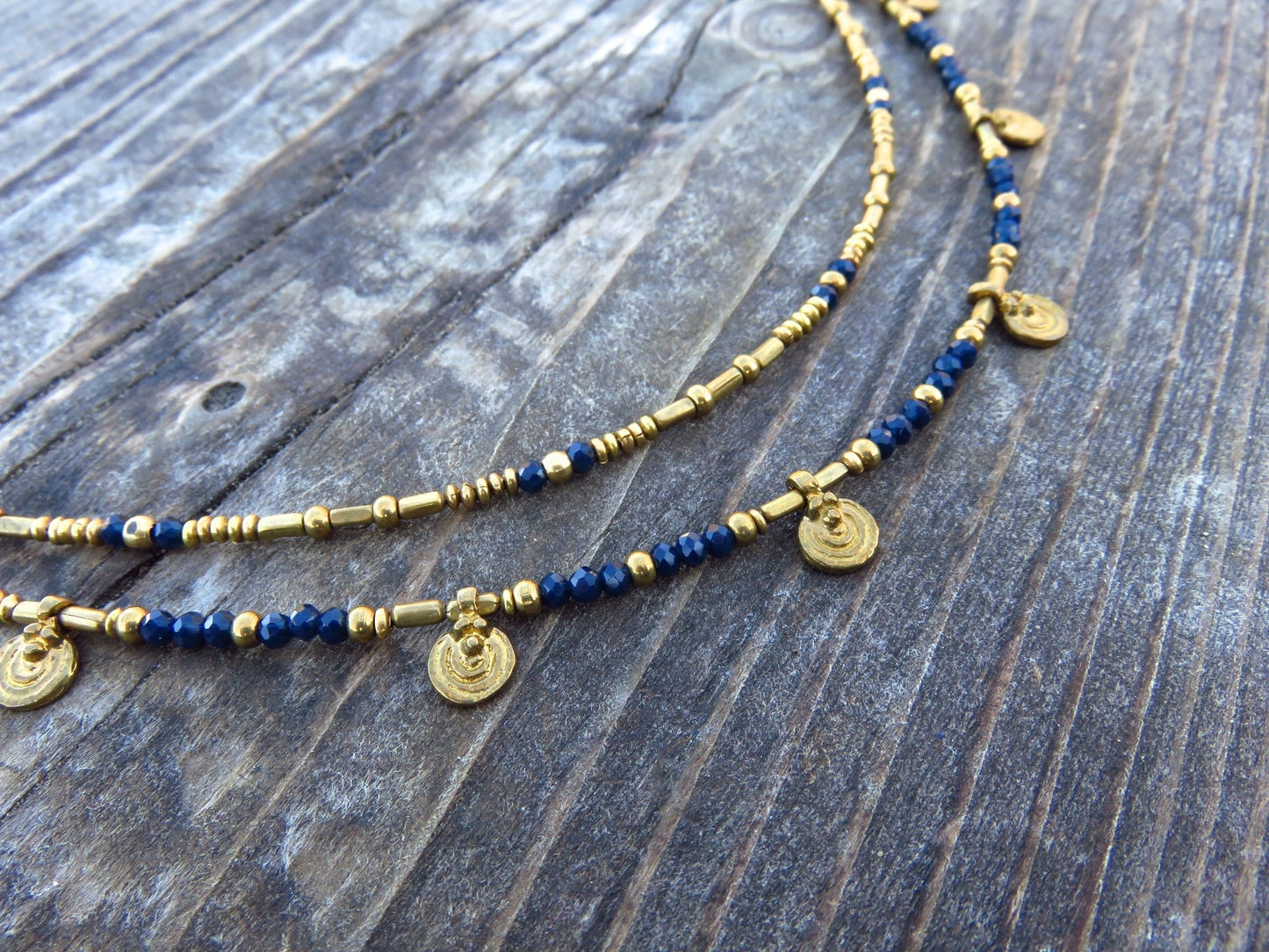 Anklet with spirals made of colored beads and brass 