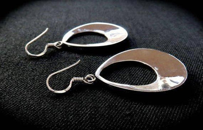 large granulated teardrop-shaped earrings made of silver 