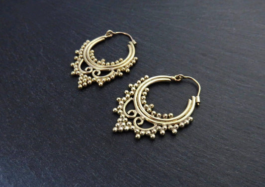 small brass hoop earrings decorated with dots 