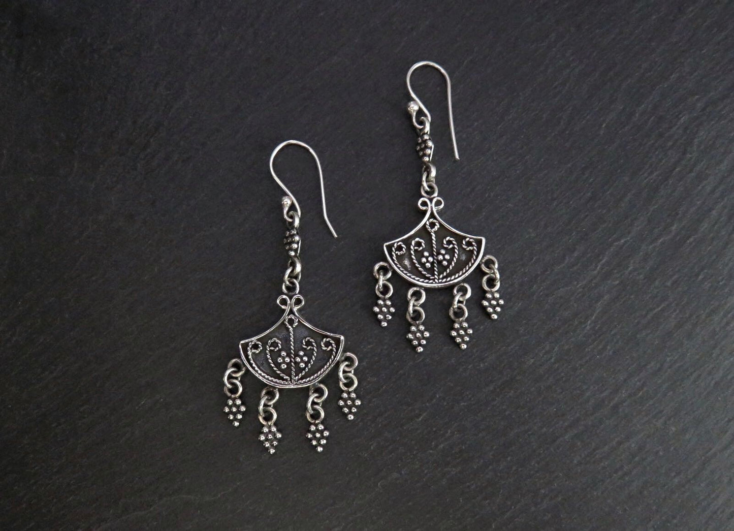Earrings with dangling silver elements 
