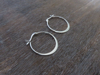 large simple hoop earrings made of silver 