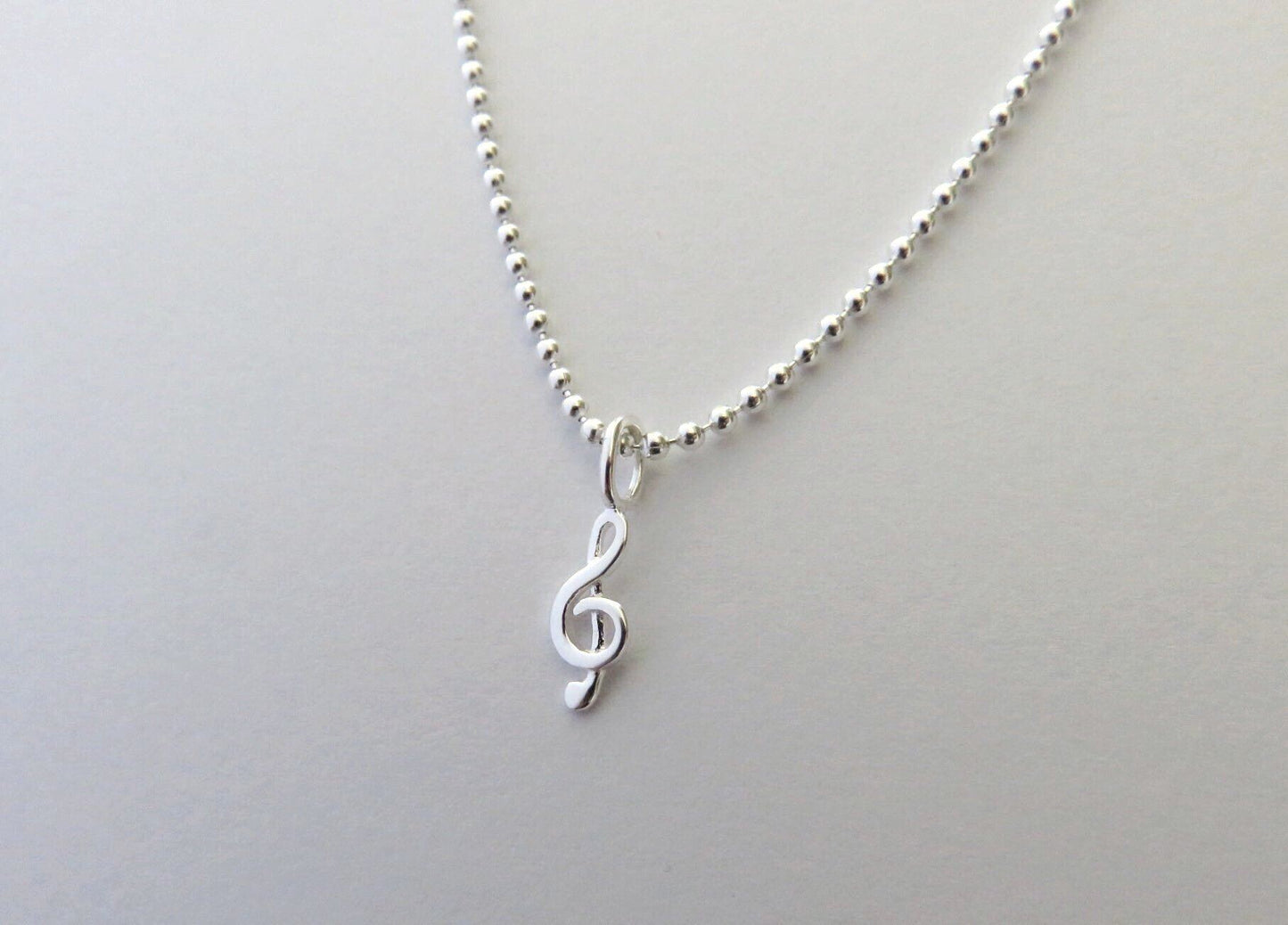 Ball chain with small treble clef made of silver